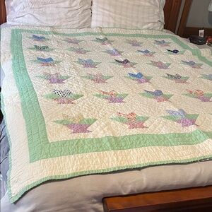 Patchwork Quilt with Green and Cream Accents